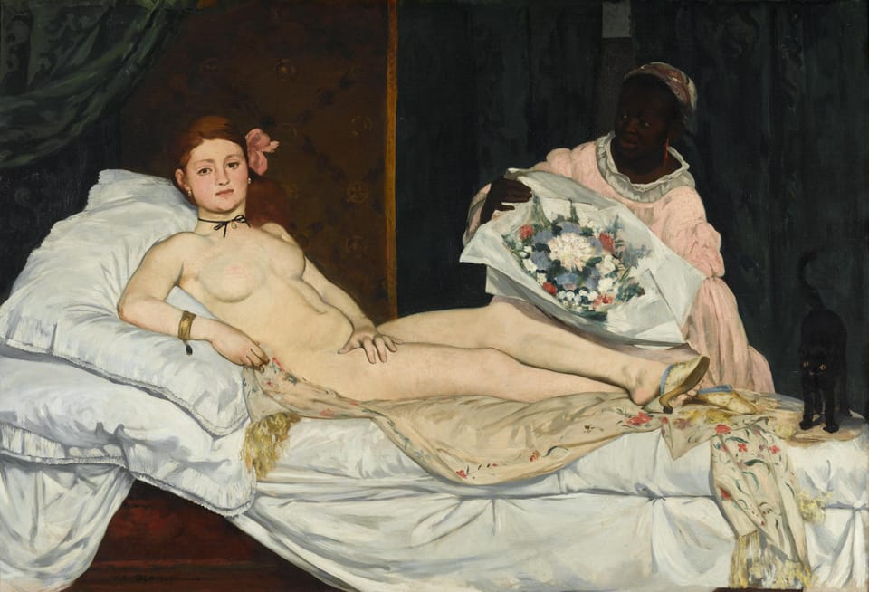 A nude white woman looks directly at the viewer as she is reclined on a bed and a black maid presents a large bouquet to her.